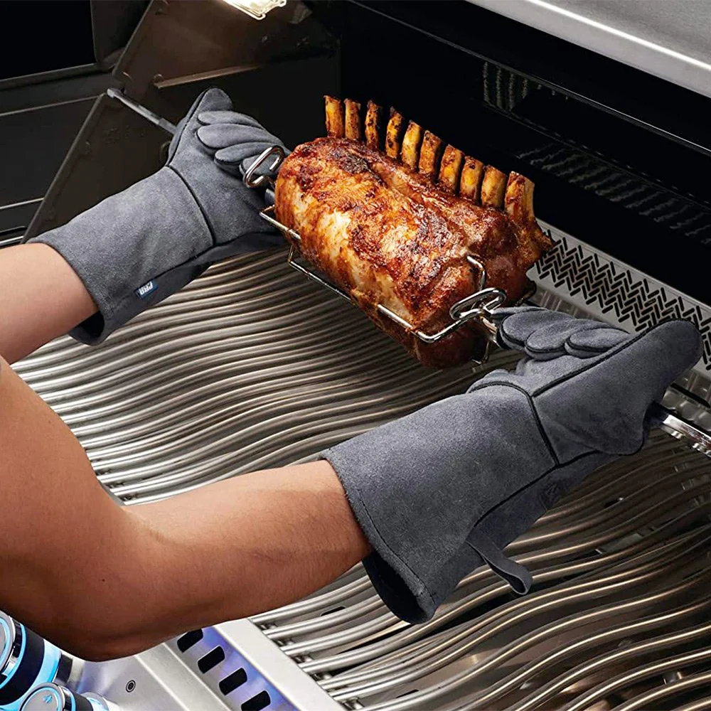 Wearing welding gloves while grilling meat
