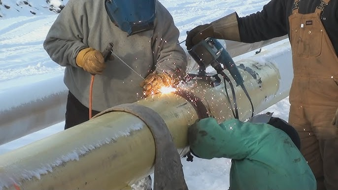 Many people wearing welding gloves in the icy and snowy conditions