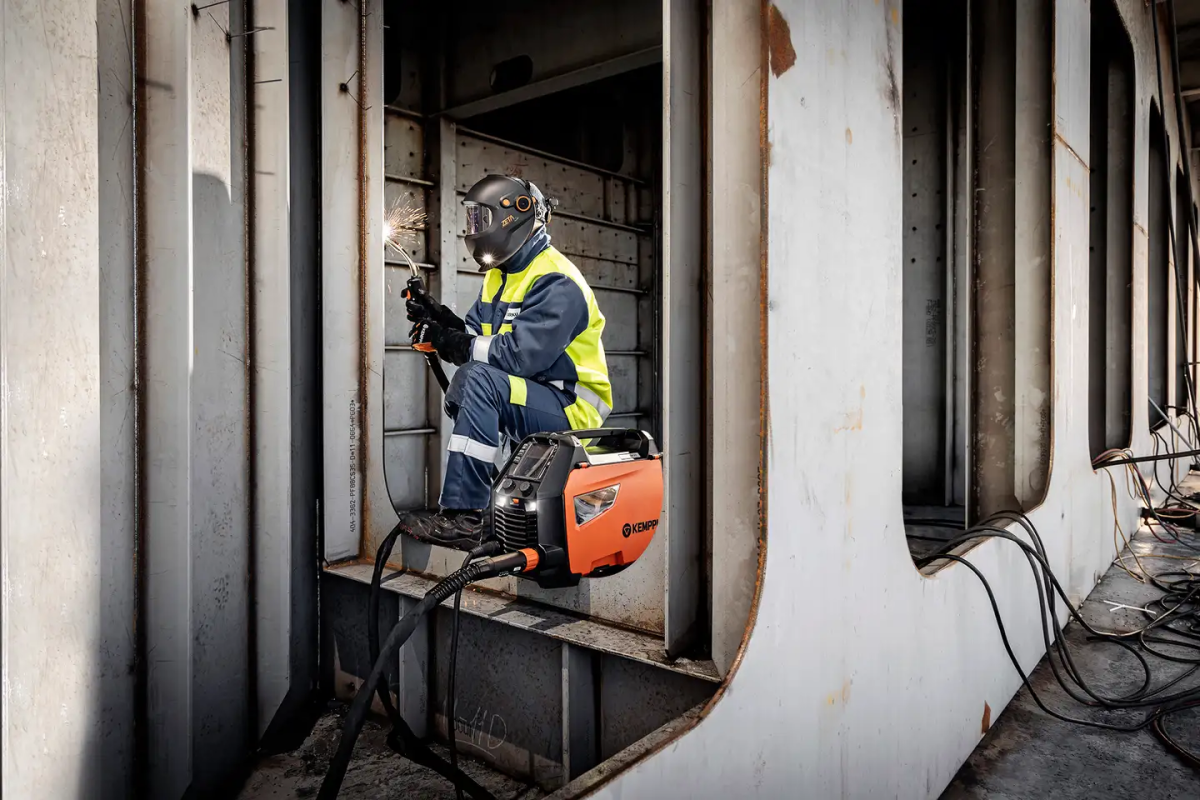 Shipyard workers wear welding gloves
