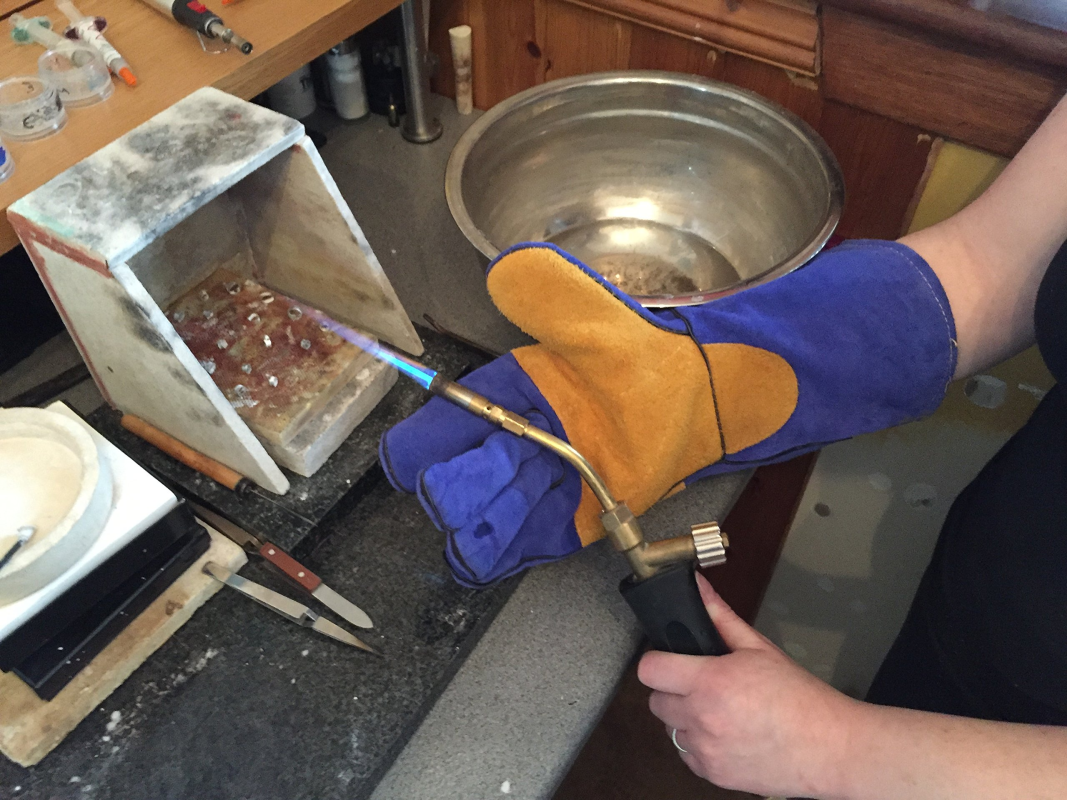 Working in the shop using welding gloves